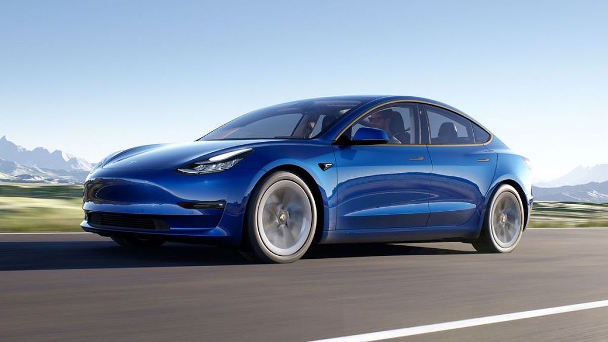 2018 Tesla Model 3 in blue driving